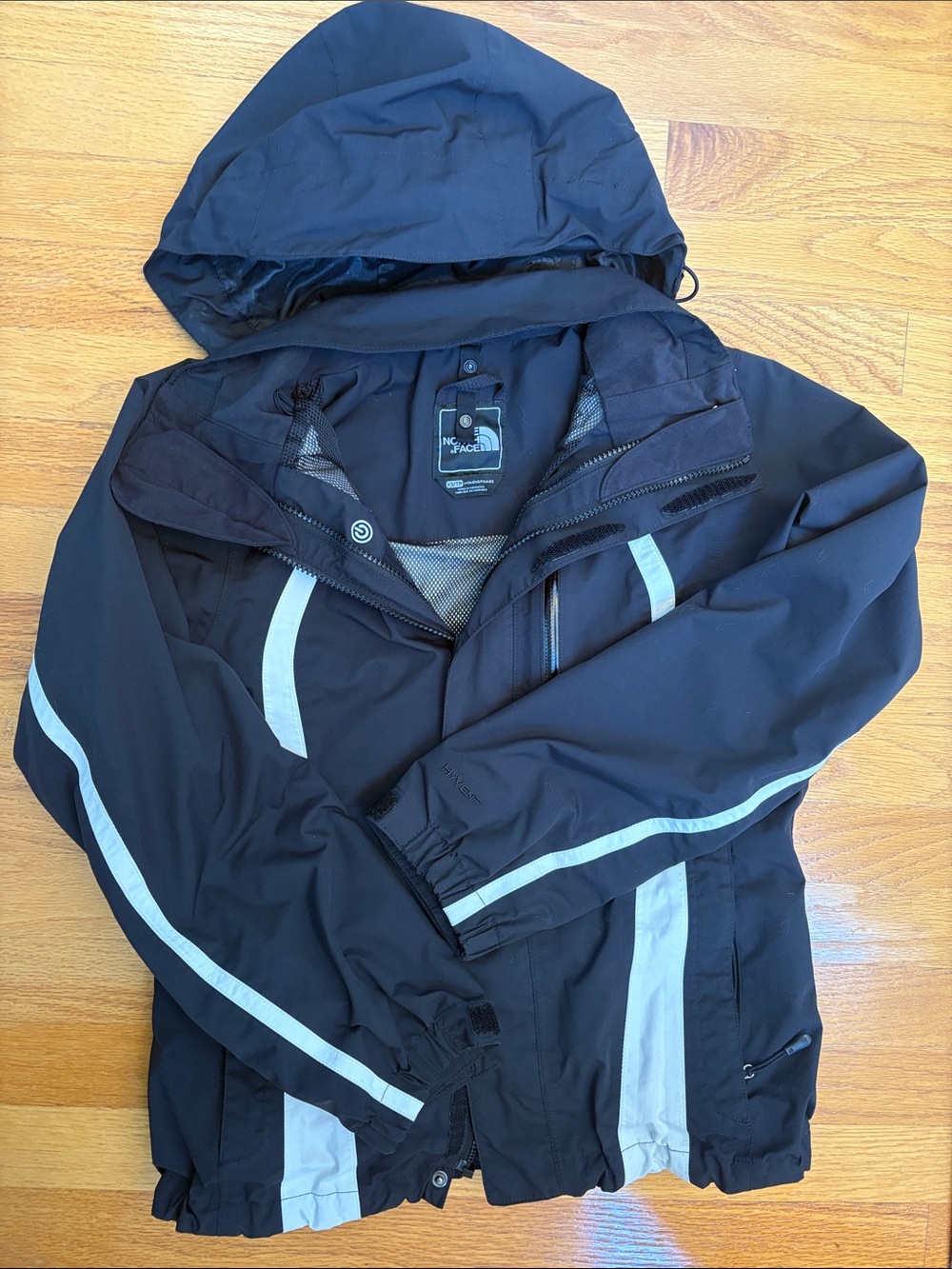 The North Face Black Ski Jacket with Light Gray Reflective Stripes